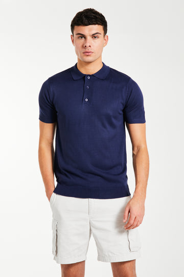 model wearing the 'Senza' knitted polo in navy