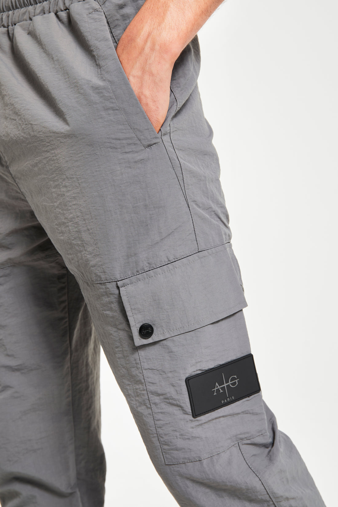 Men's cargo trousers close up in charcoal grey