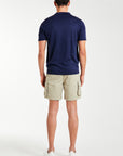 back profile of model wearing men's utility shorts and polo