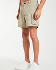 model wearing 'Williams' men's utility shorts in oatmeal