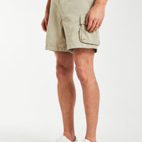 model wearing 'Williams' men's utility shorts in oatmeal