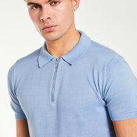 close up of men's knitted polo with zip up collar in light blue