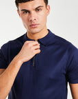 close up of zip knitted polo in a dark blue