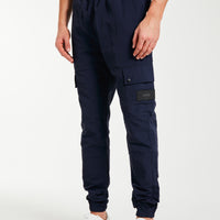 Model wearing men's cargo pants sale with elasticated waist band in navy