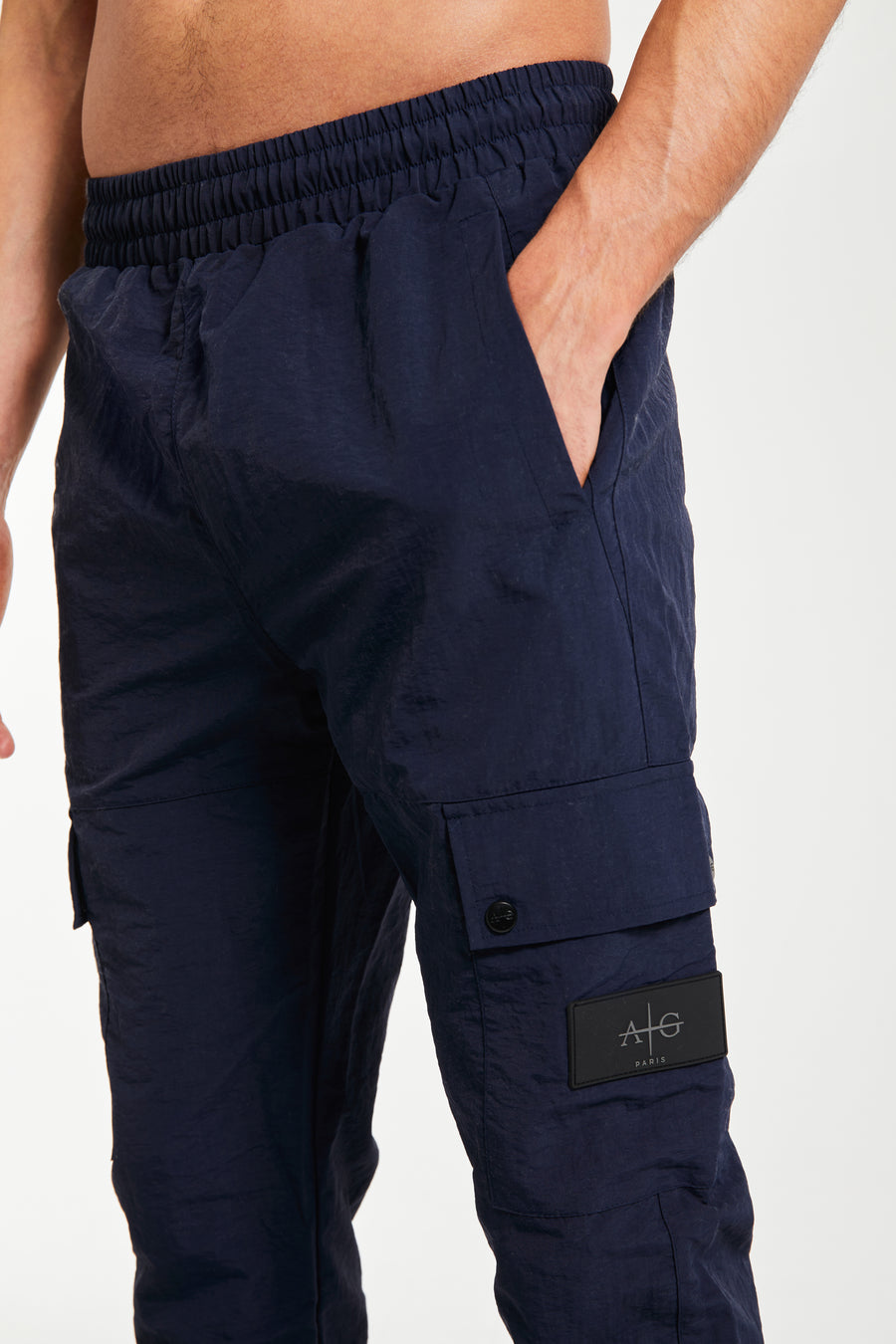 Men's cuffed cargo pants sale close up showing 'Avant Garde Paris' logo in navy blue