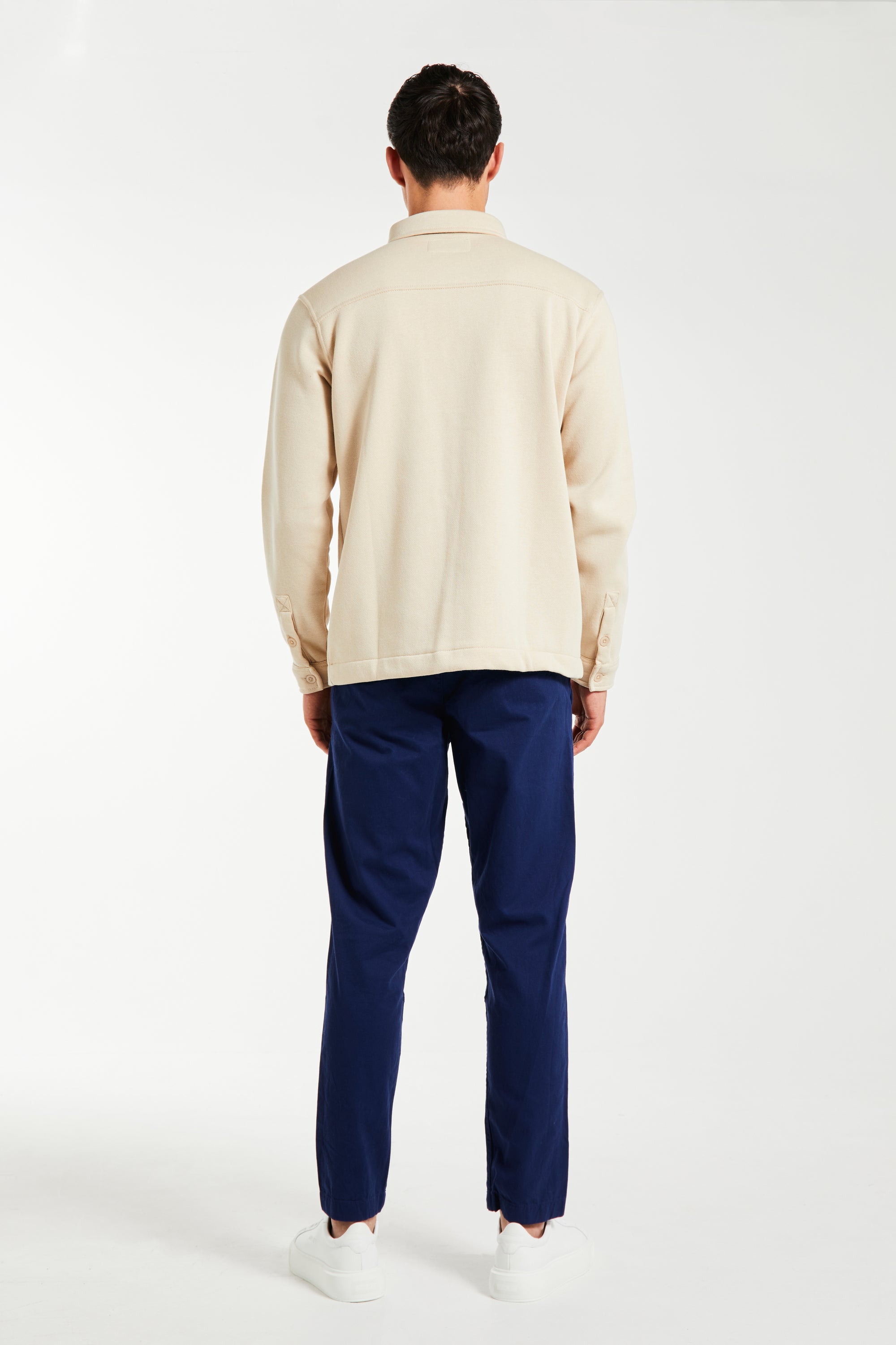 back profile of navy blue men&#39;s chino pants