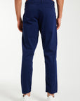 Back profile of men's chino pants in dark blue