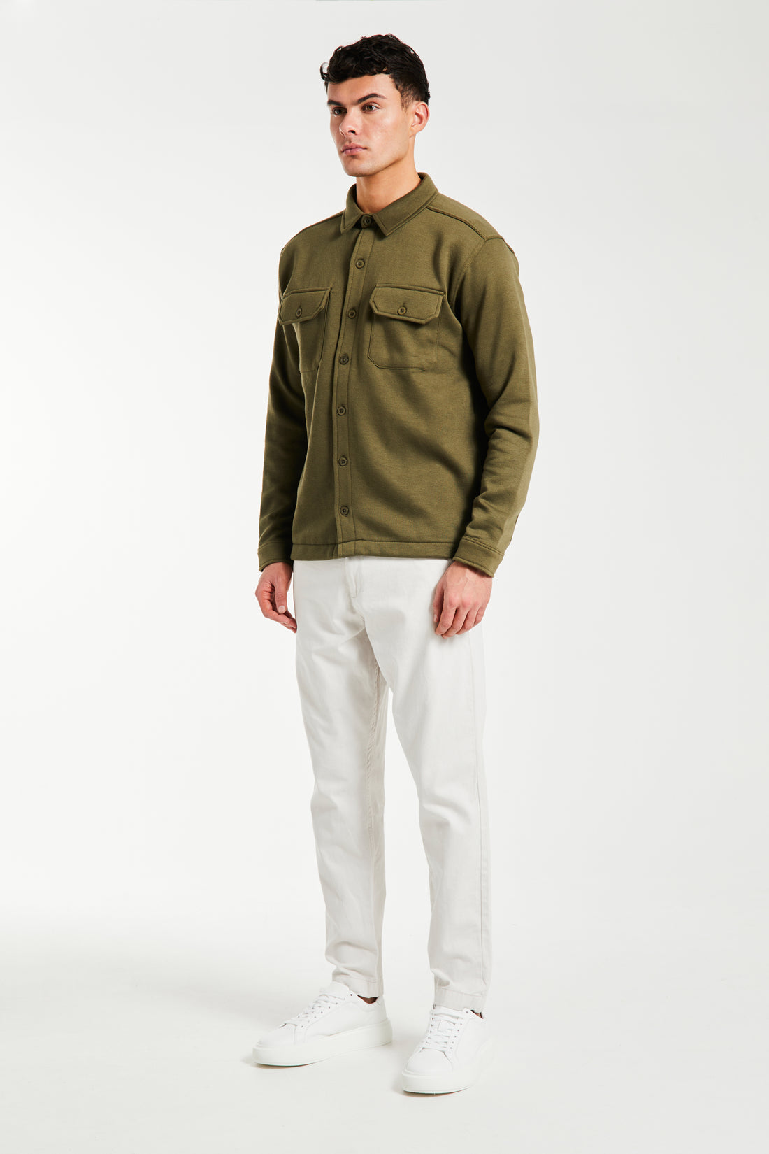 Model wearing outfit with men's chino sale on in white