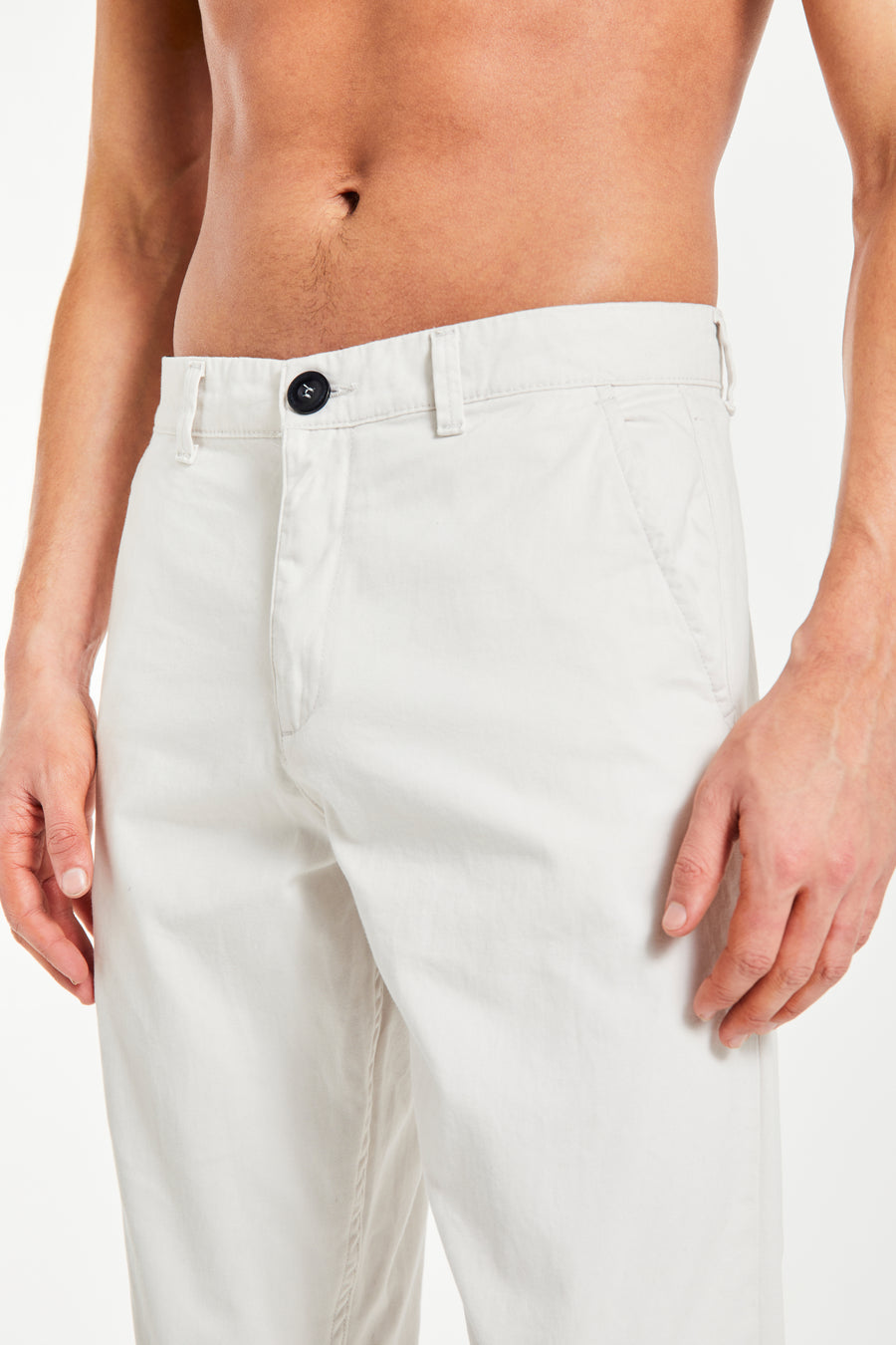 Close up of cheap men's chinos with black button