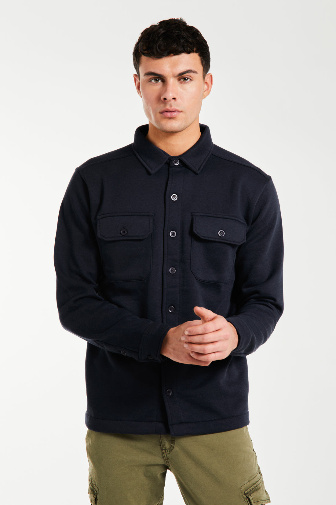 Model wearing dark navy blue overshirt with buttons