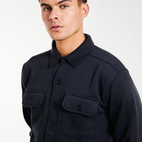 Close up of button up overshirt in navy blue