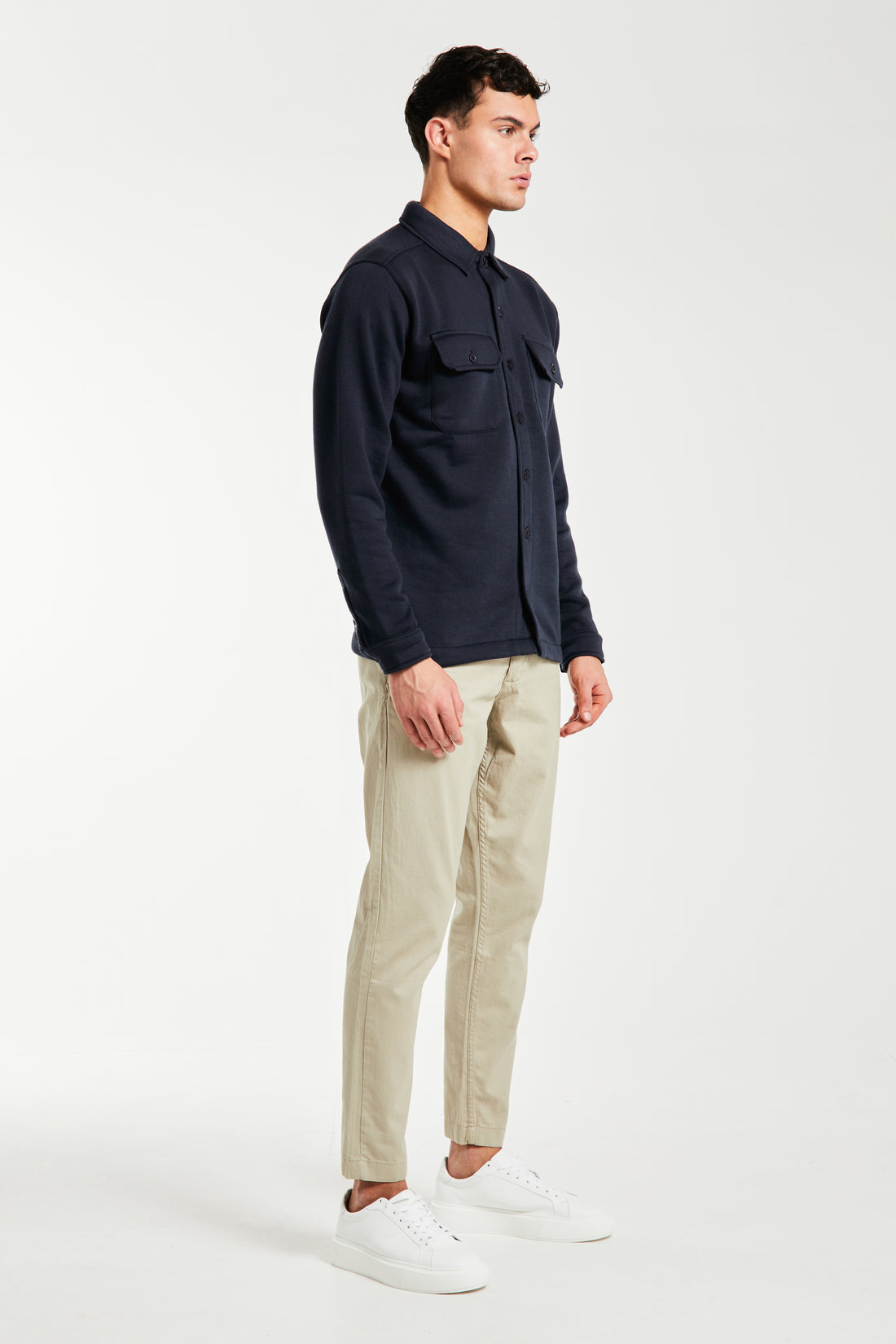 Side profile of men's chino pants in sand
