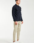 Side profile of men's chino pants in sand