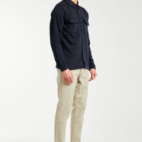 Side profile of men's chino pants in sand