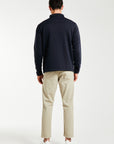 back profile of cheap men's chino pants in beige