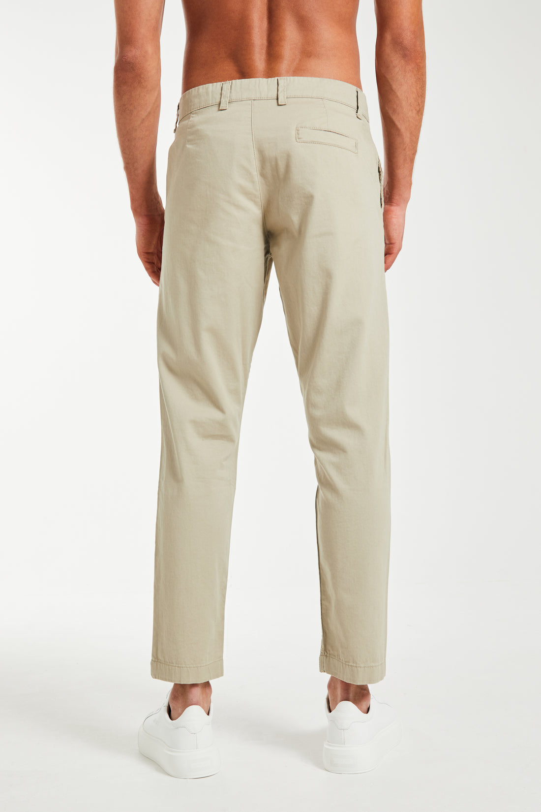 back profile of cheap men's chinos in beige