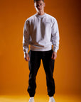 Man wearing grey marl sweatshirt