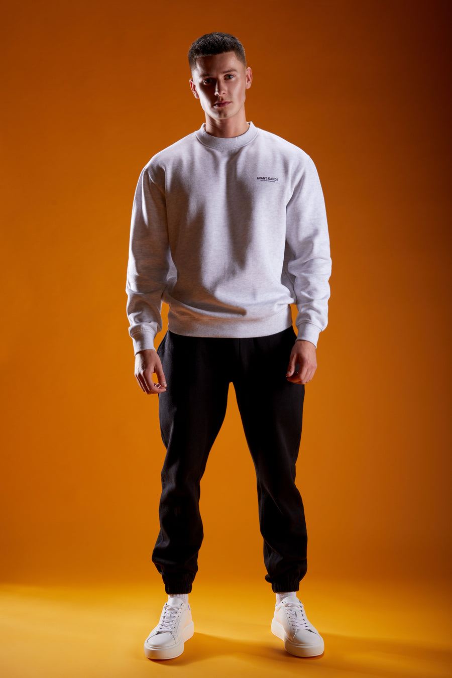 Man wearing grey marl sweatshirt