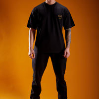 Model wearing mens graphic t-shirt in black
