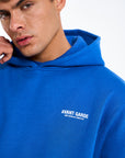 Small logo detail on royal blue hoodie