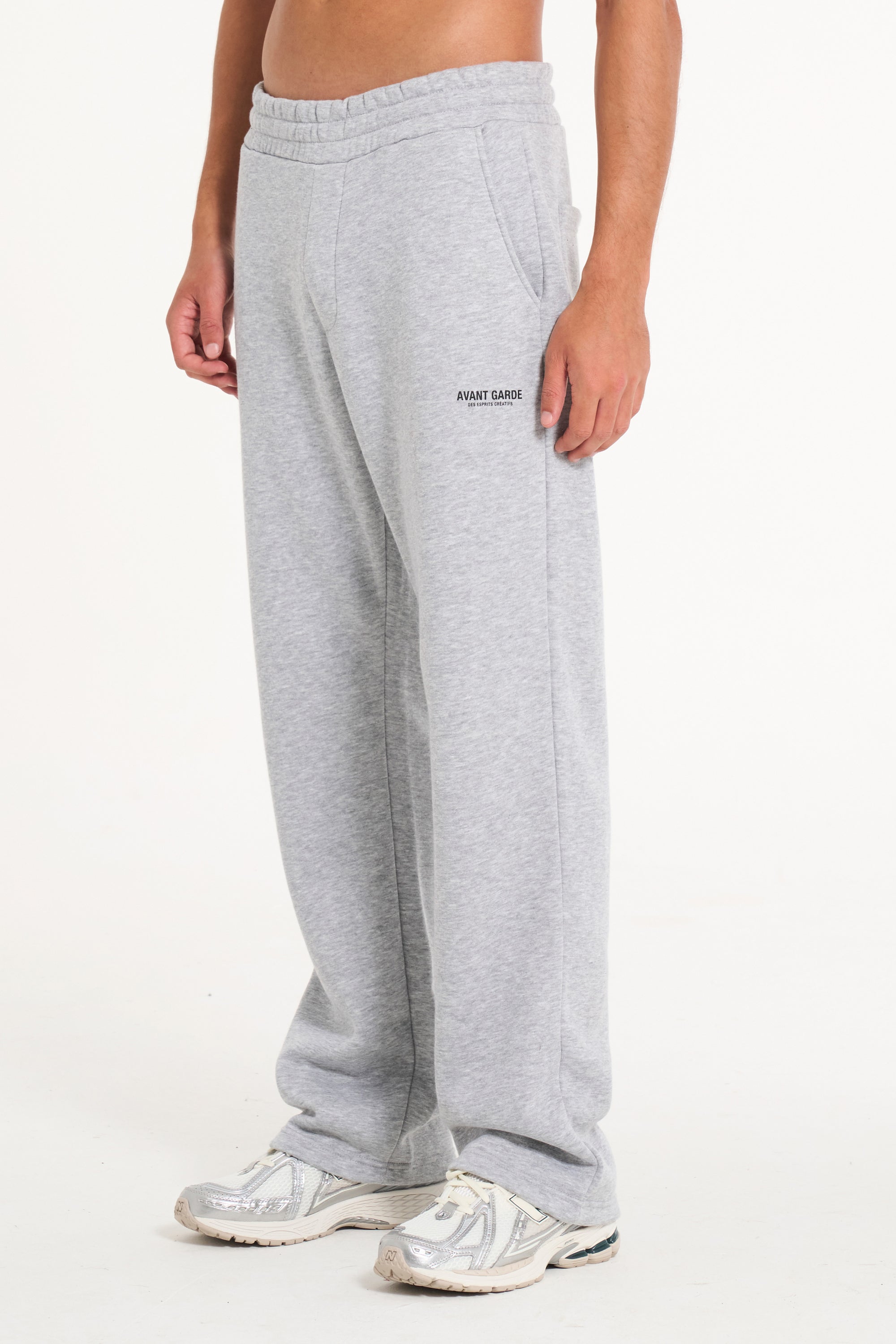 Men's tracksuit bottoms in grey with Avant Garde logo on upper leg