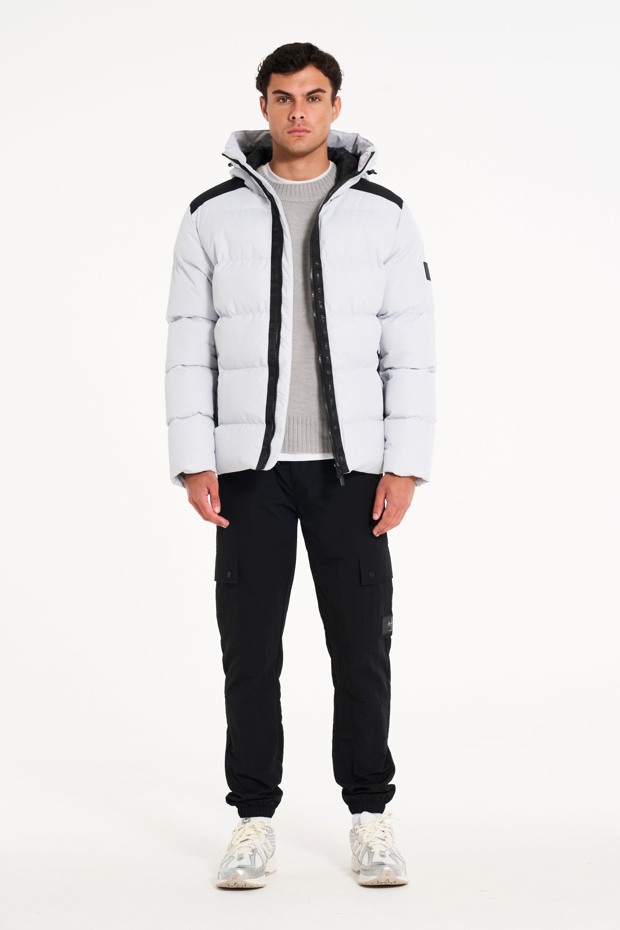 Alps Puffer Jacket and black cargo pants