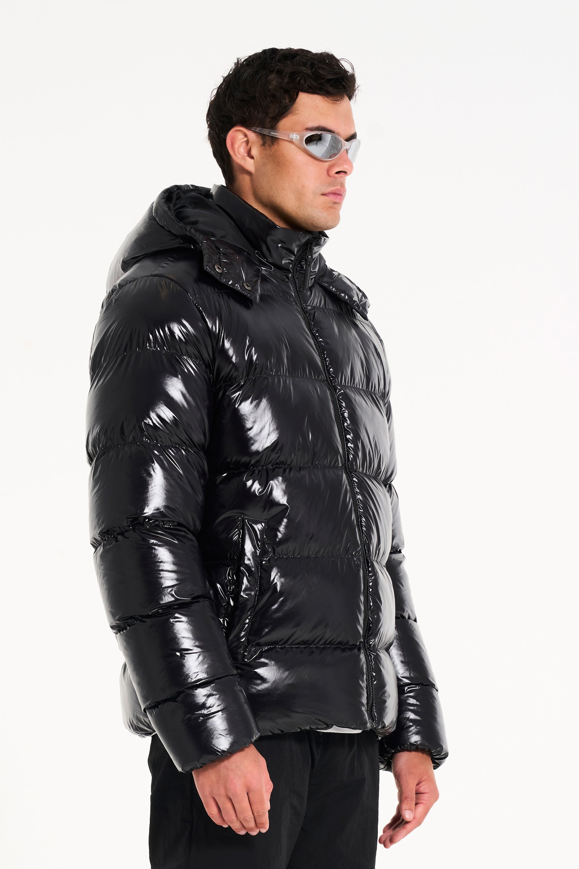 hooded puffer jacket in black (side profile)