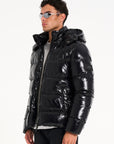 Man in sunglasses and black puffer jacket