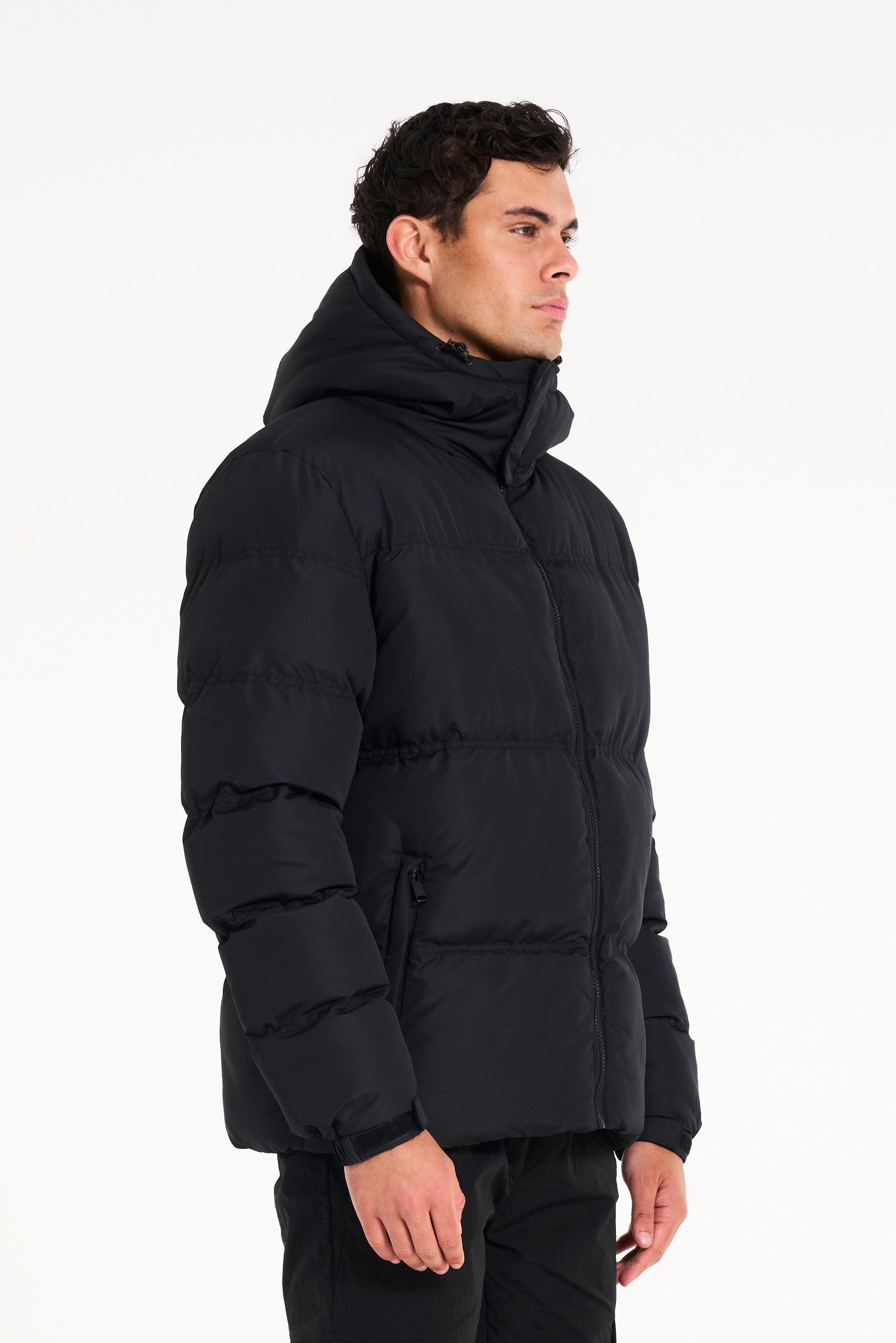 Male model wearing black puffer jacket