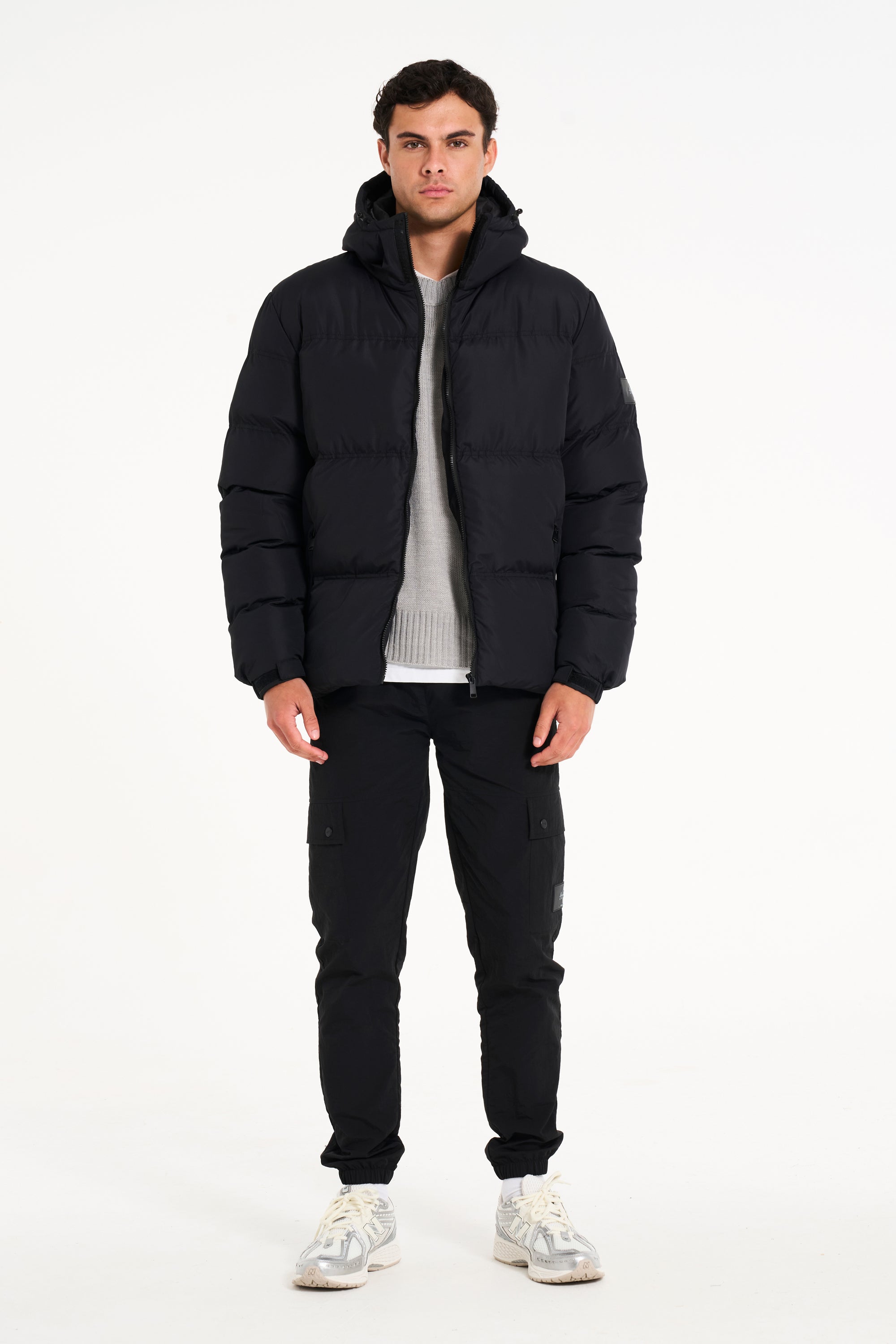 Front view of mens puffer jacket in black