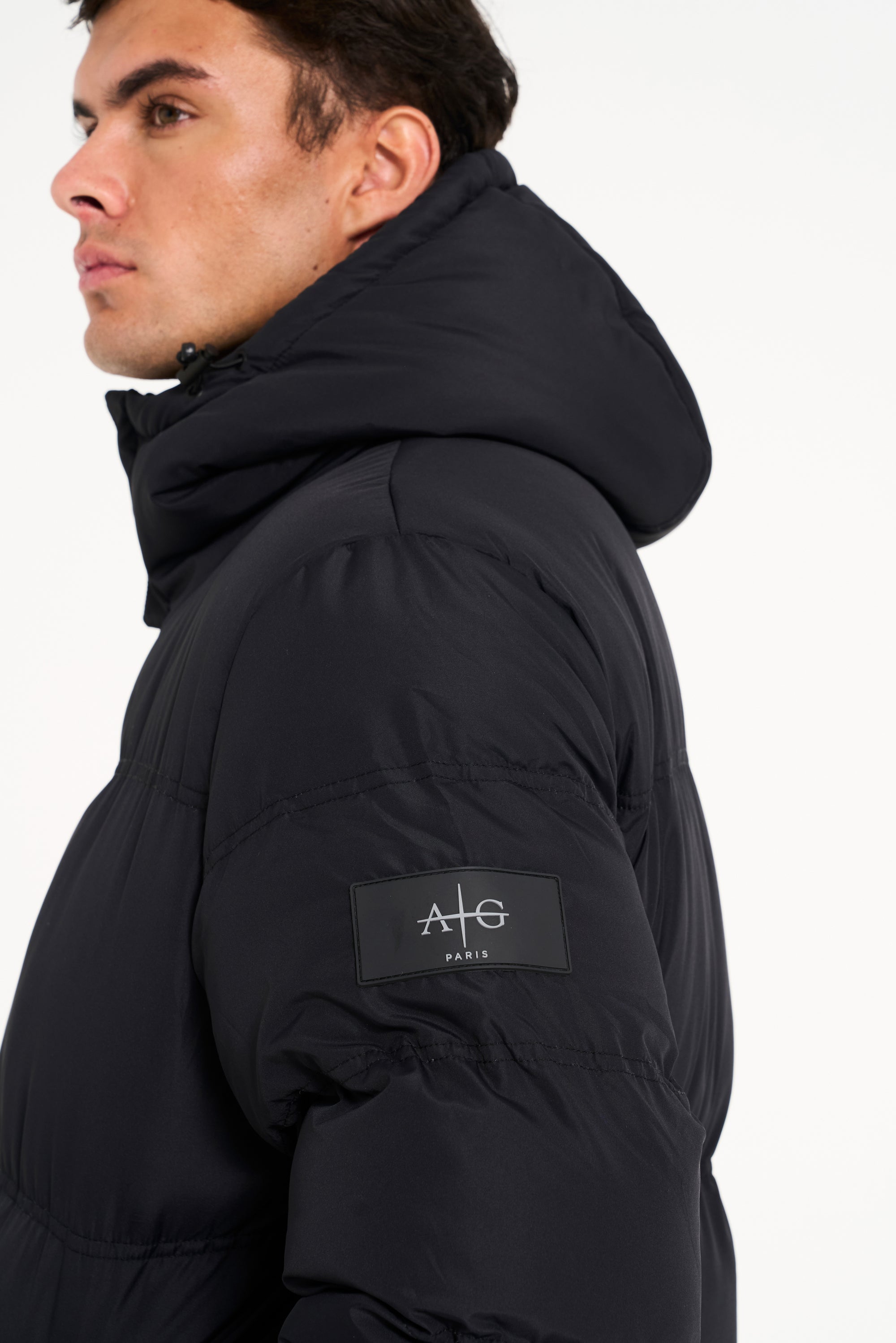 Logo detail of mens black puffer jacket