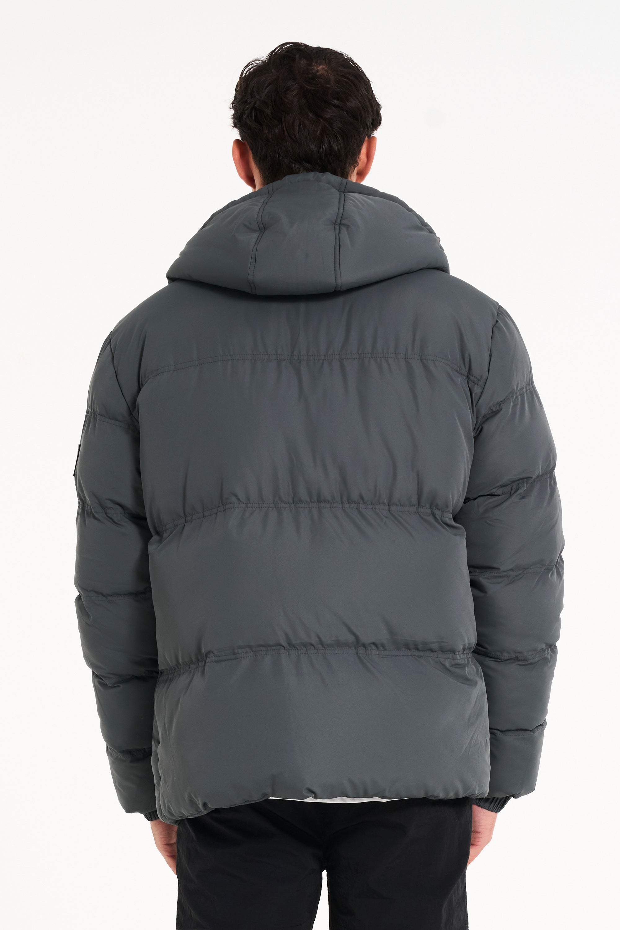 Back of charcoal puffer jacket