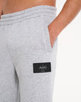 Avant Garde tracksuit bottoms showing badge logo on upper leg