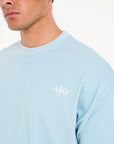 Close up shot of Avant Garde crew neck T-shirt in sky blue