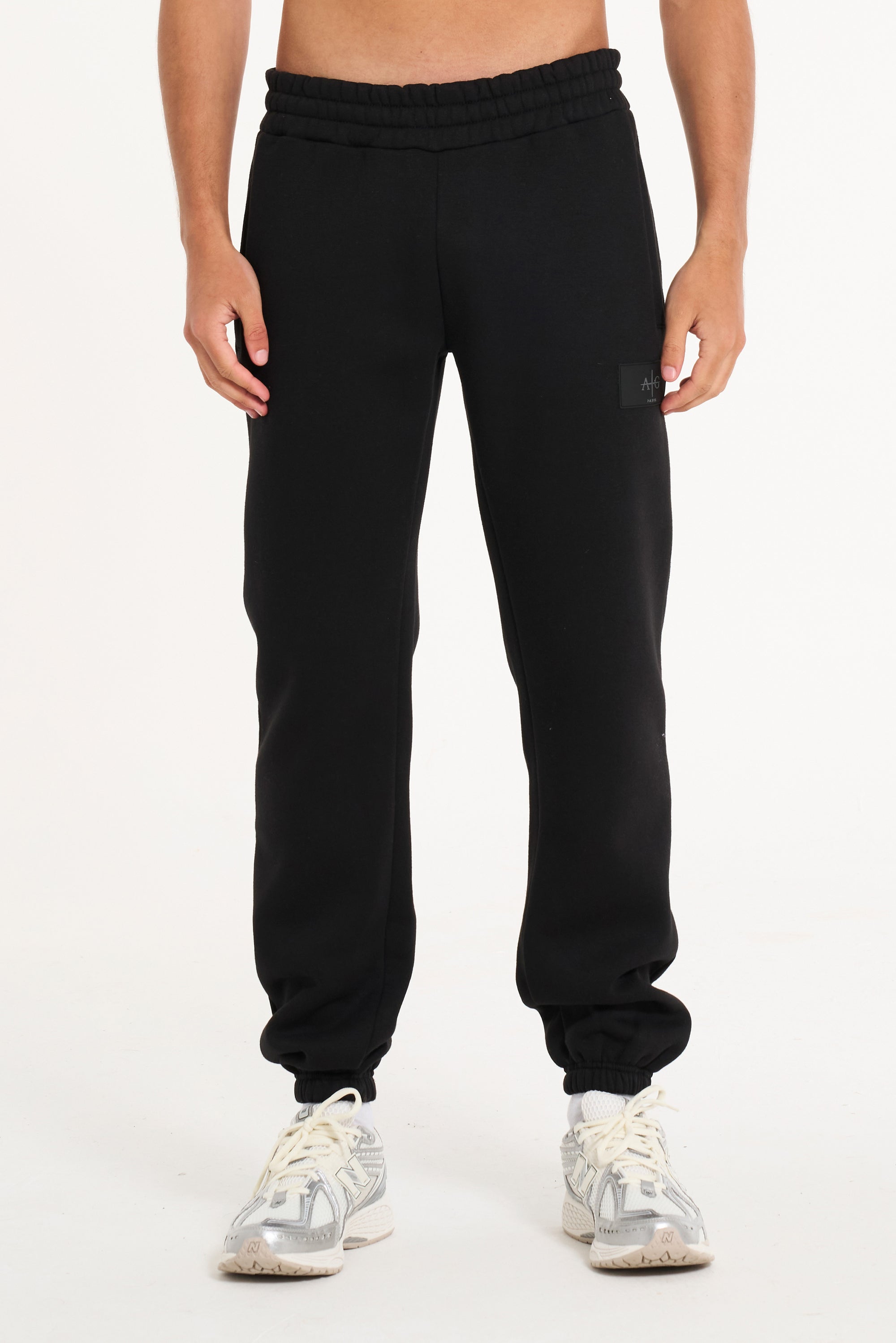 Close up shot of men&#39;s tracksuit bottoms in black