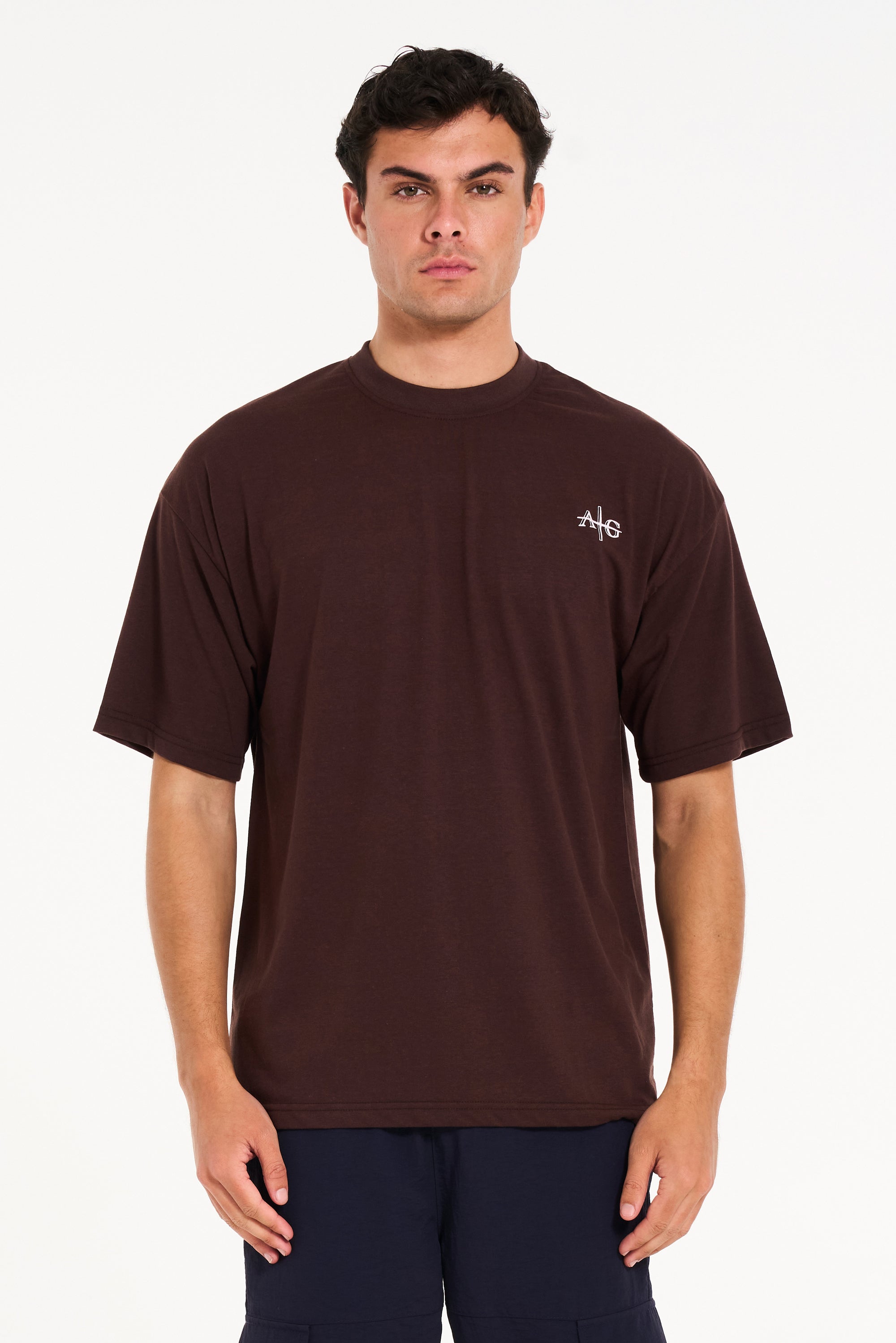 Front shot of male model wearing brown crew neck T-shirt