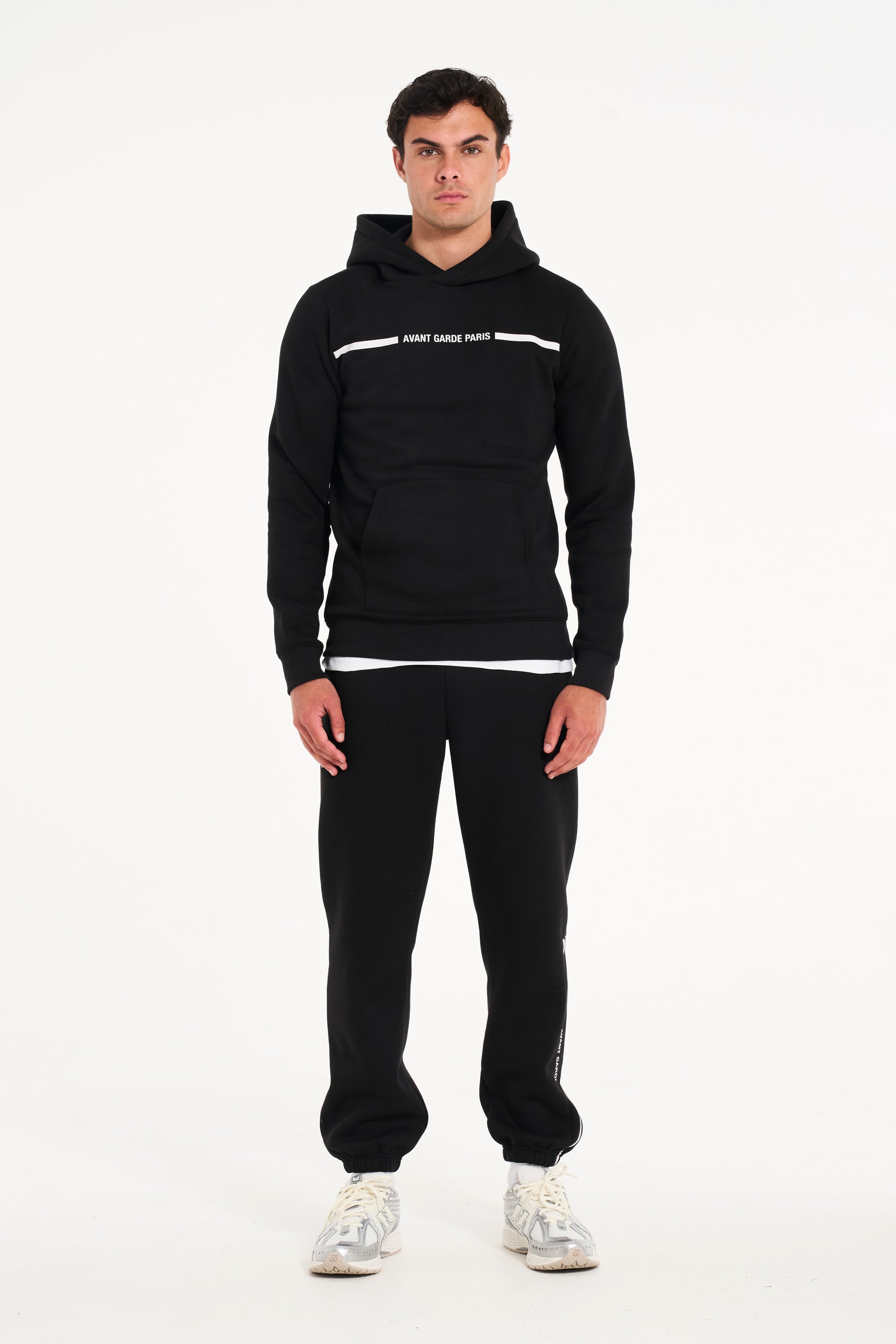 Model stood facing forward wearing men's full tracksuit