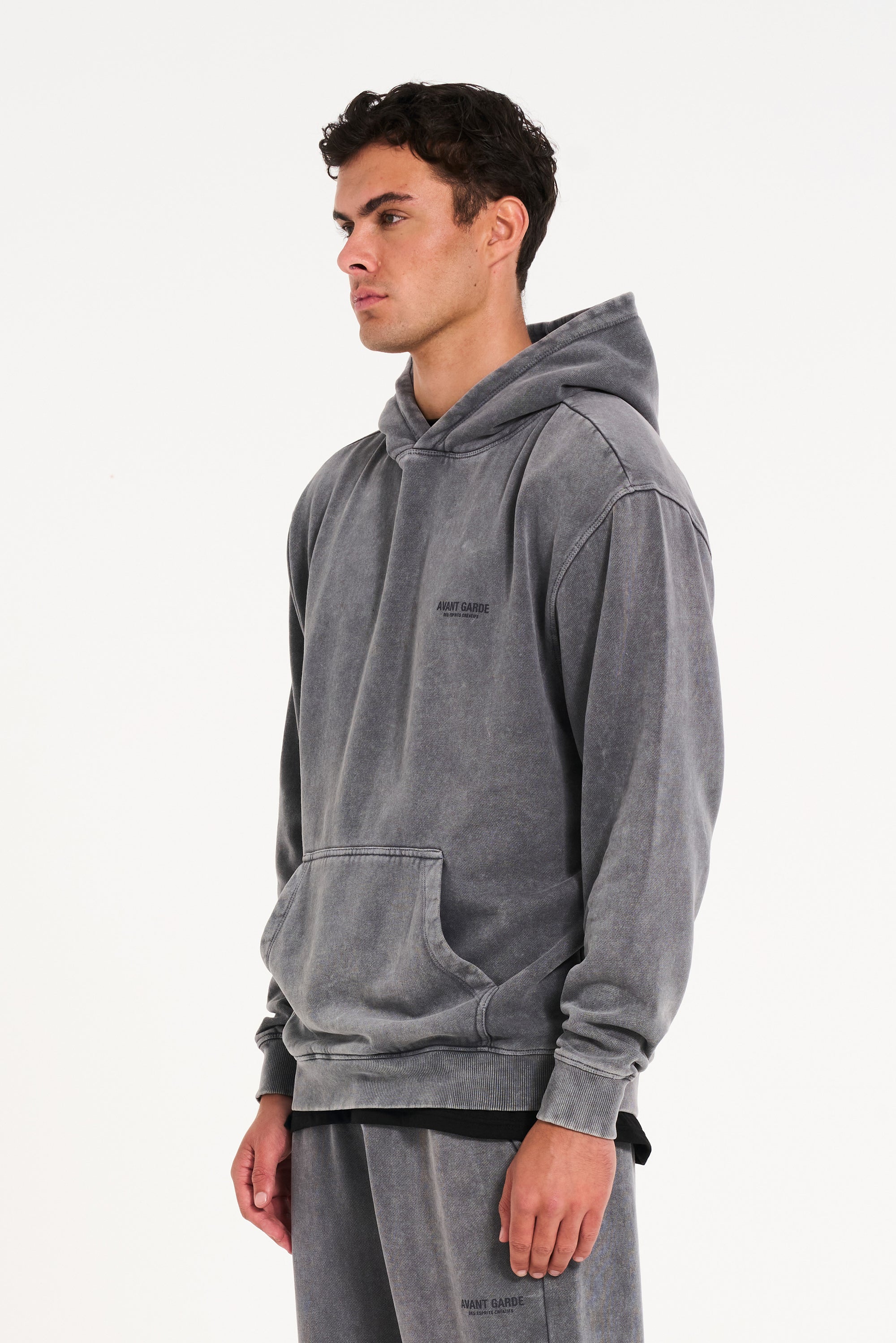 Model facing to the left wearing men's hoodie in steel