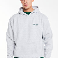 Model wearing men's hoodies sale in light grey marl