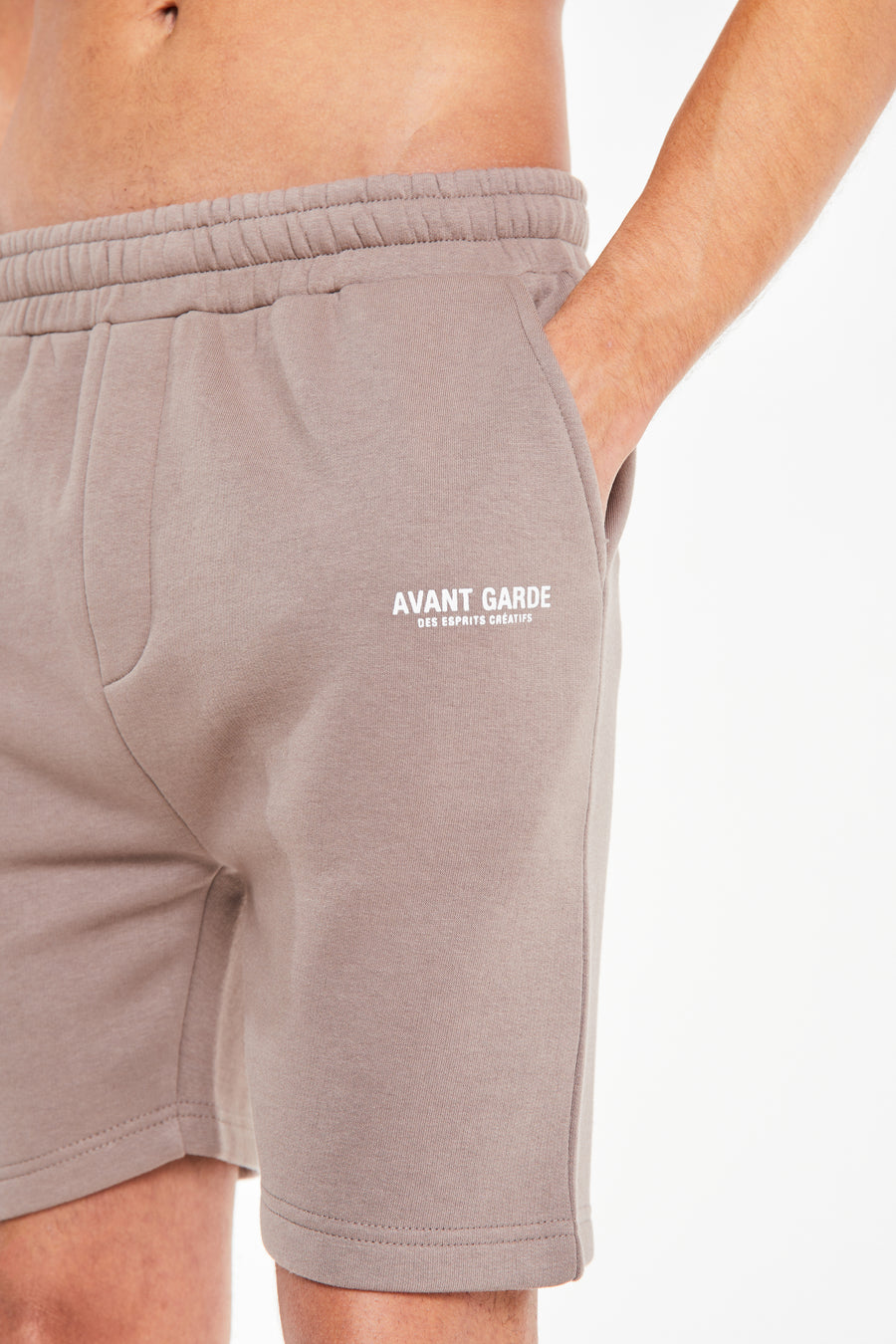 close up of 'avant garde paris' logo on mix jersey shorts in sale