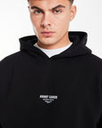 close up of 'Avant Gard Paris' logo on black men's hoodie 