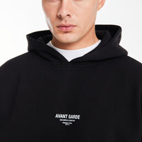 close up of 'Avant Gard Paris' logo on black men's hoodie 