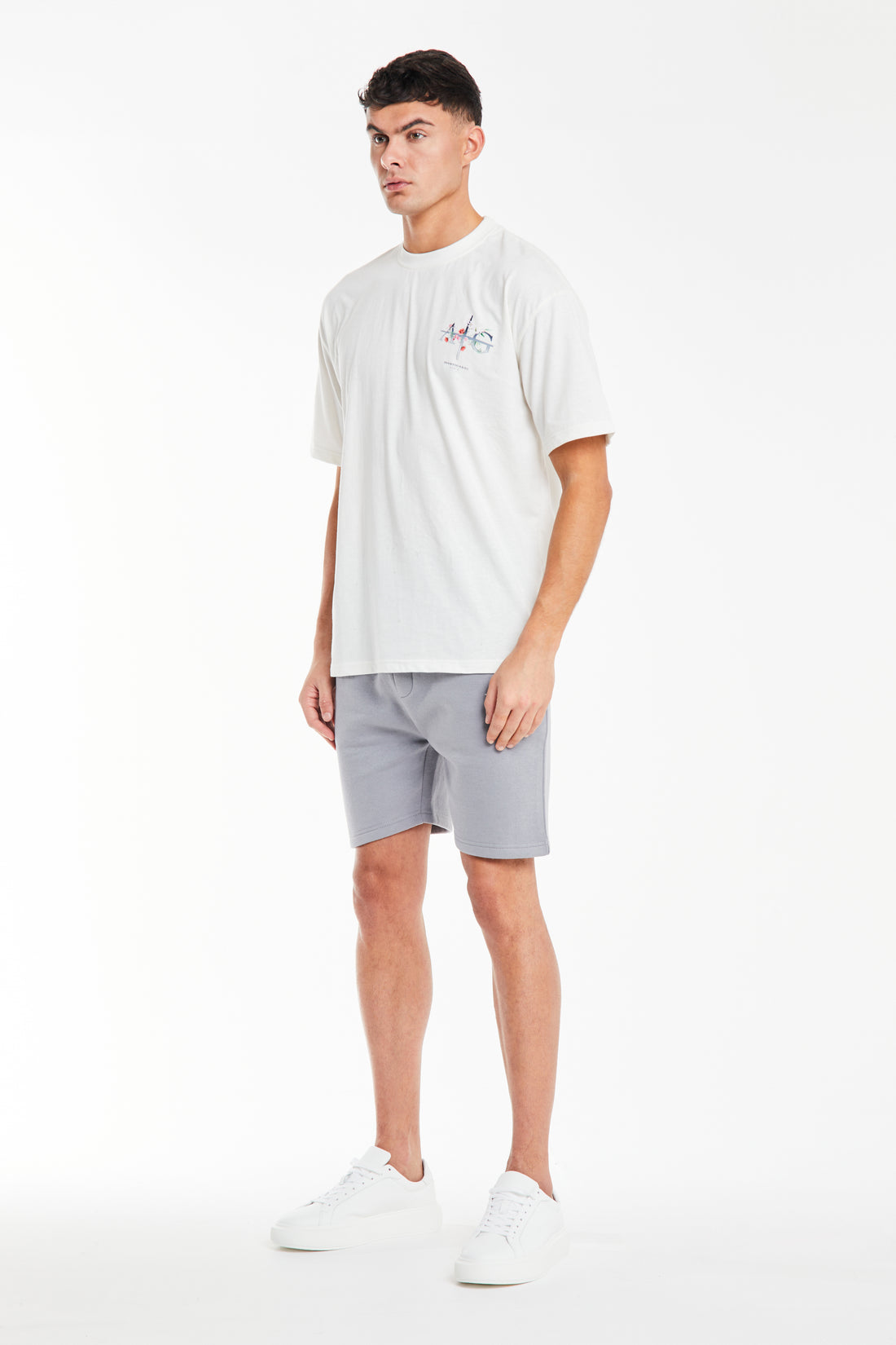 Model styled in white t shirt sale styled with shorts