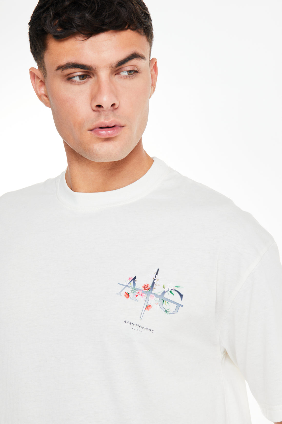 White men's t shirt showing close up of 'Avant Garde Paris' graphic logo 