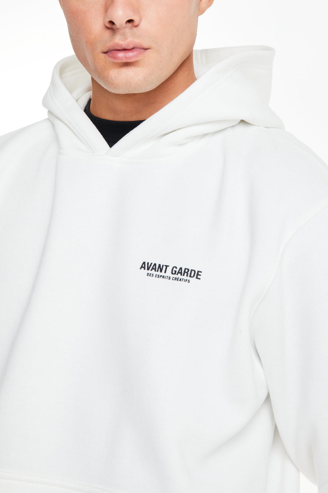 close up of 'avant garde' logo on chest of a mens hoodie sale in white