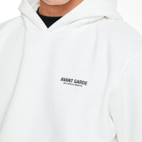 close up of 'avant garde' logo on chest of a mens hoodie sale in white