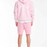 back profile of light pink men's hoodies sale with 'avant garde' logo