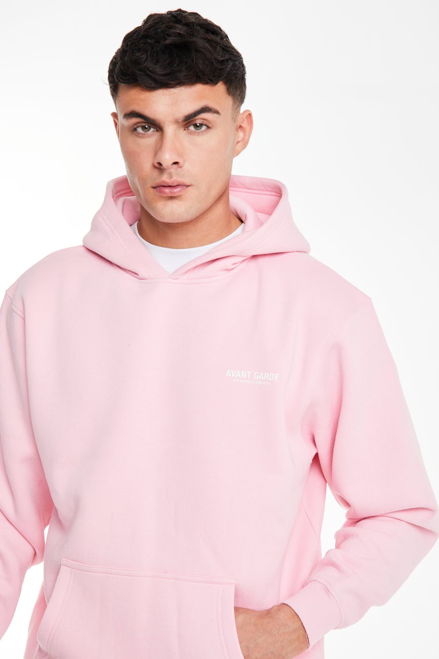 close up of men's hoodies in pink with 'avant garde' logo on chest
