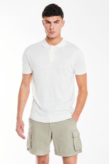 Model wearing white button knitted polo 