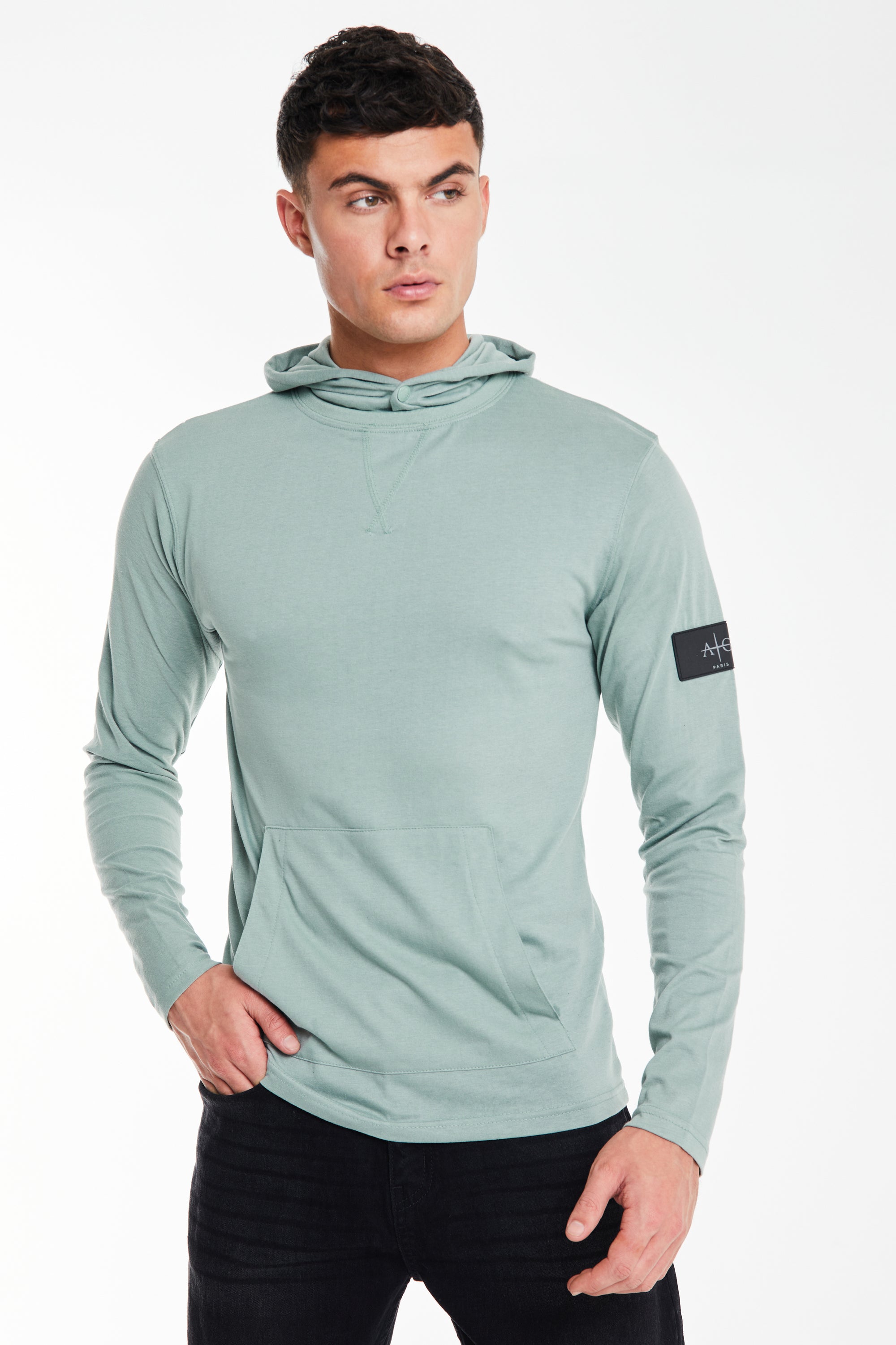 Model wearing a &#39;Collusive&#39; plain hoodies for men in mint green